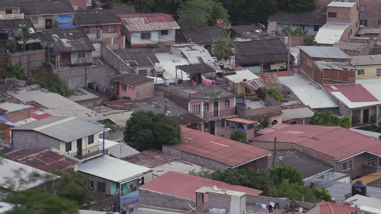 A close group of houses with corrugated roofing in Tegucigalpa, Honduras