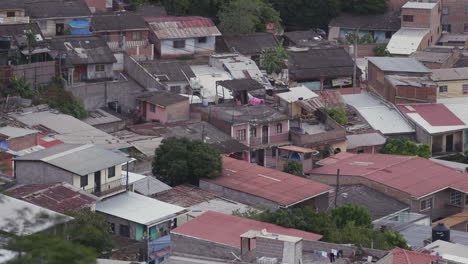 a close group of houses with corrugated roofing in tegucigalpa, honduras