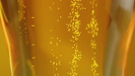 close-up of a glass of beer with bubbles