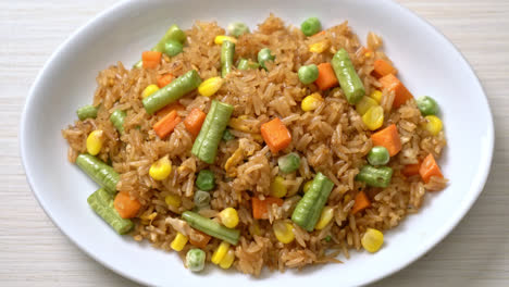 fried rice with green peas, carrot and corn - vegetarian and healthy food style