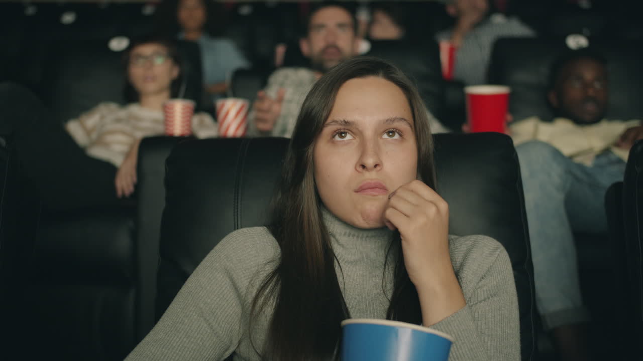 Teenager Watching Movie in Cinema
