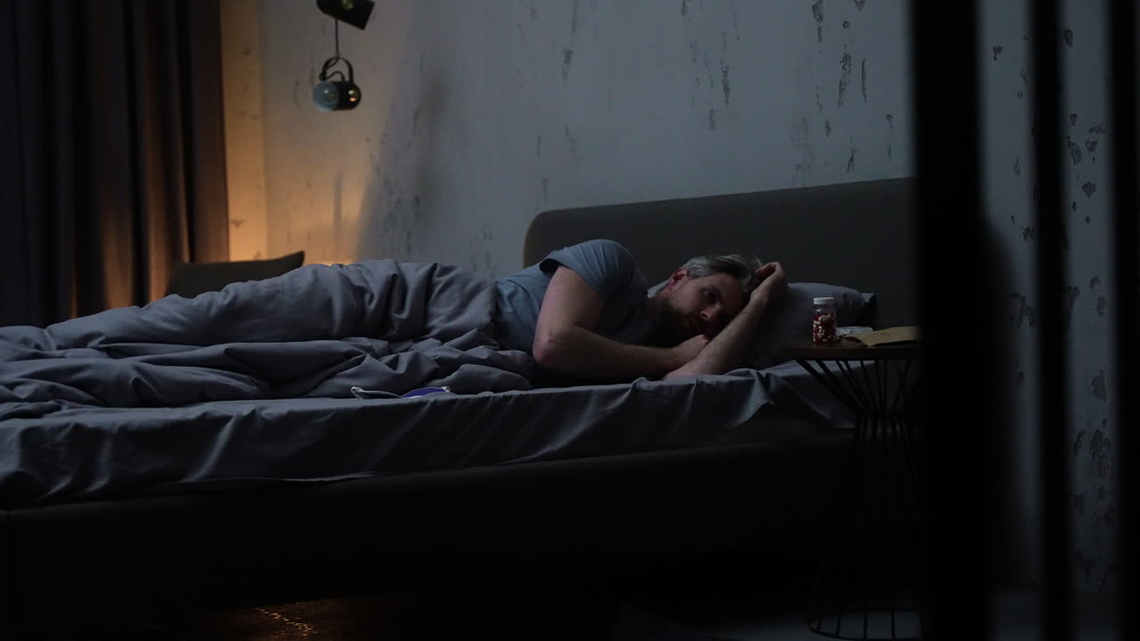 Man in the bedroom at night