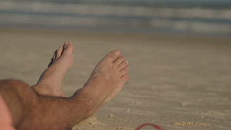 Feet-of-a-person-on-the-sand