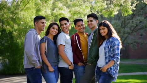 diverse group of smiling young adults outdoors