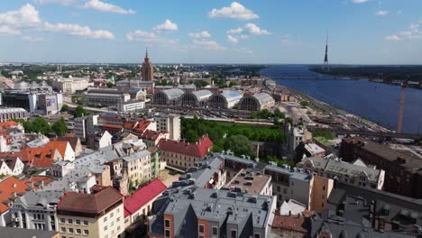 Forward-Drone-Shot-Above-Downtown-Riga,-Latvia---Riga-Central-Market