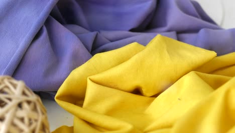 close-up view of folded yellow and blue fabric