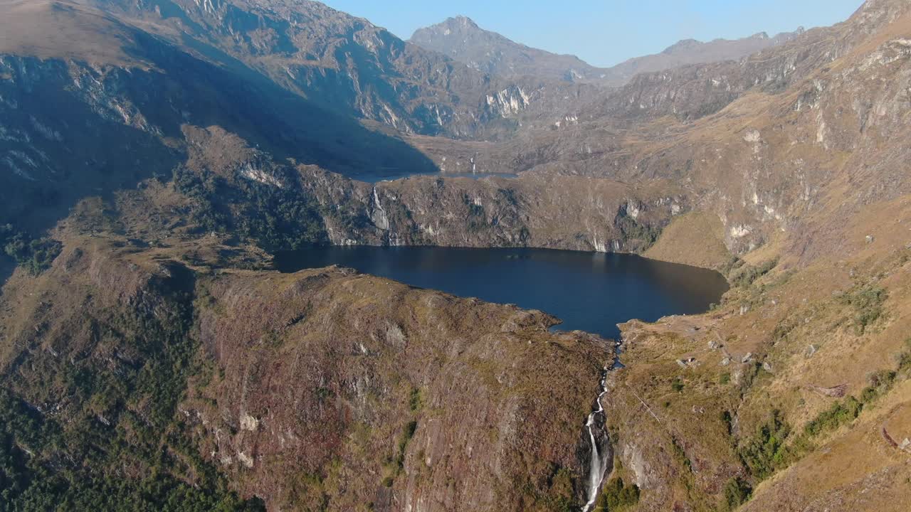 4k aerial drone footage over the first lagoon (lake) of Pichgacocha from Ambo, Huanuco, Peru in the Andes mountains. Steady zoom in wide angle shot.