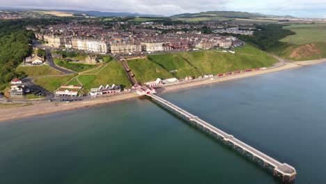 aerial drone view of saltburn-by-the-sea, saltburn pier and ocean in cleveland, north yorkshire in summer, early morning