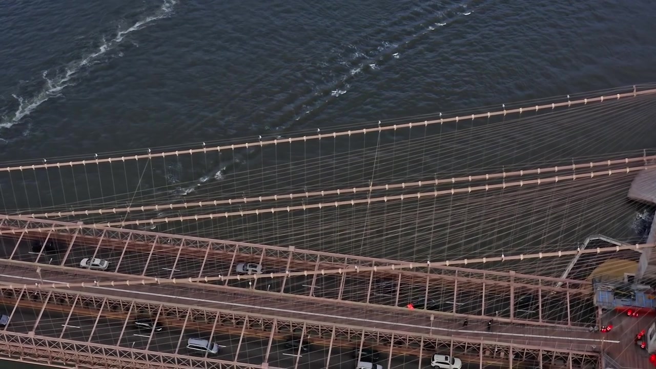 Brooklyn Bridge connects Manhattan and Brooklyn with cars and pedestrians