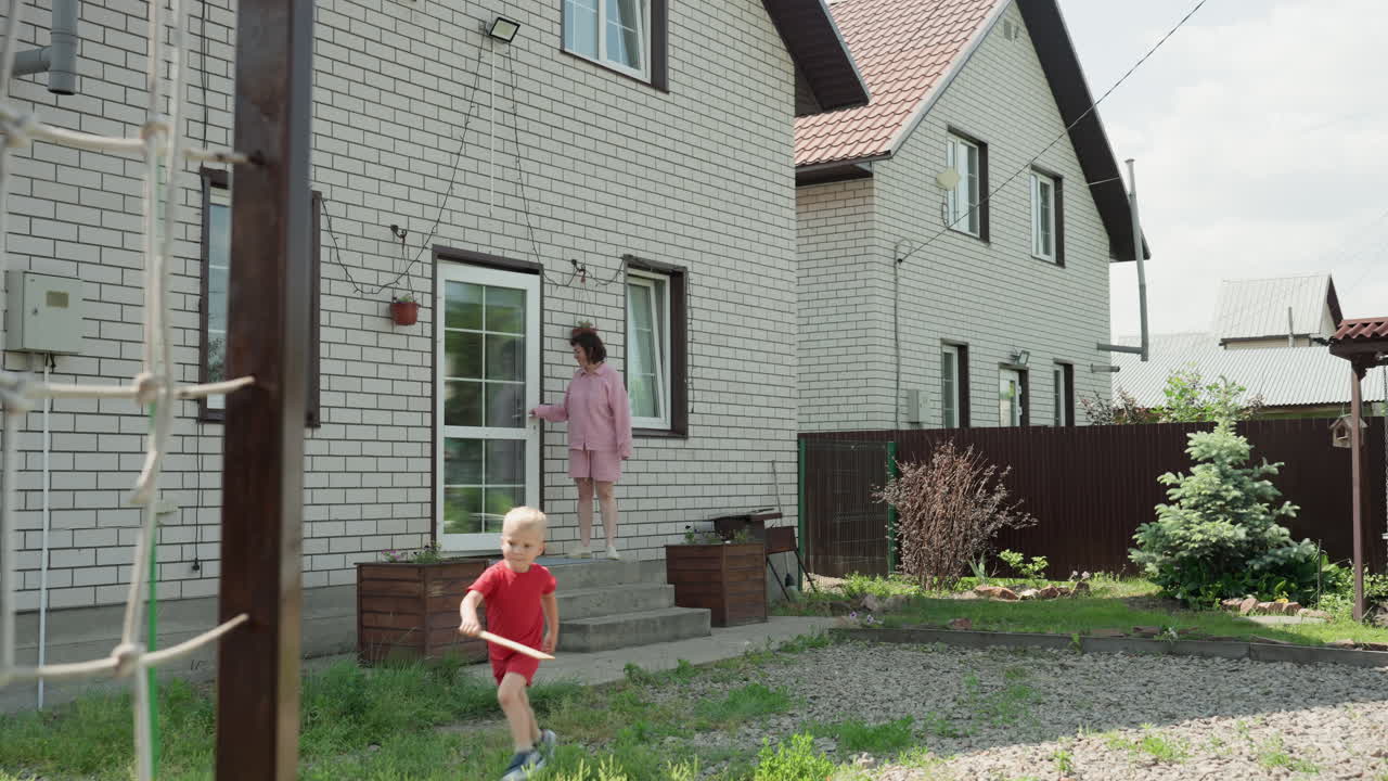 Youthful Energetic Leap, Teenager Bounds Into Garden Area, Adolescent Jumps From Porch Into Outdoor Leisure Space, Teenage Individual Makes Lively Leap Into Landscaped Suburban Backyard Environment
