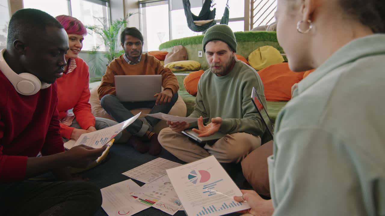 Team of Start-Up Workers Discussing Documents