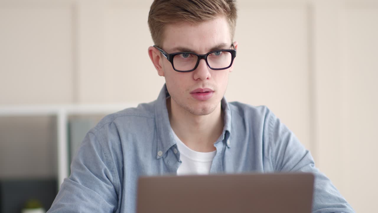Young man working on a laptop