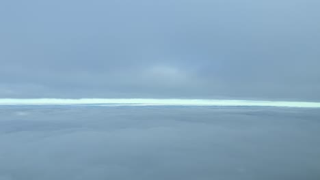 Winter-sky-view-from-a-jet-cockpit,-while-flying-between-layers-of-stratus-clouds