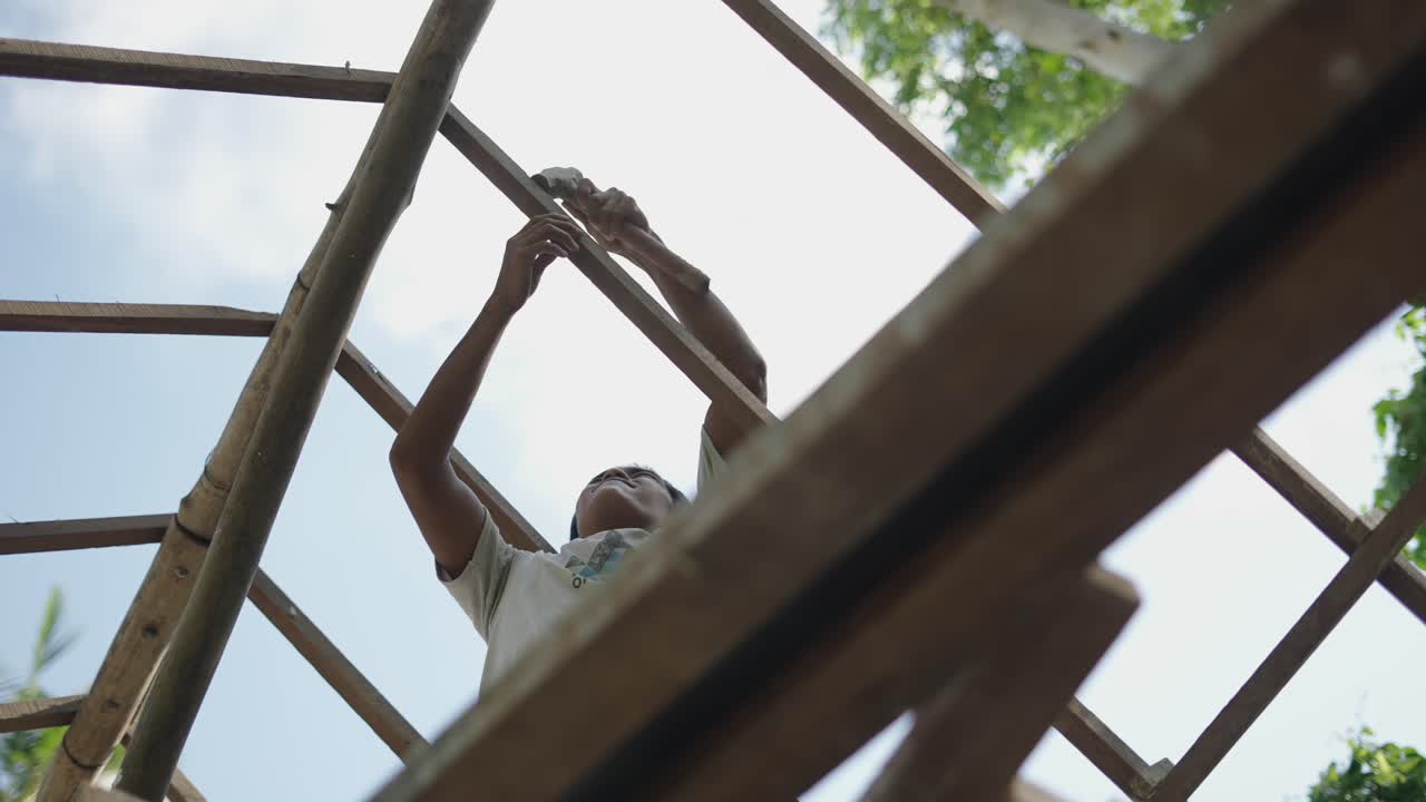 Man working on a wooden construction frame