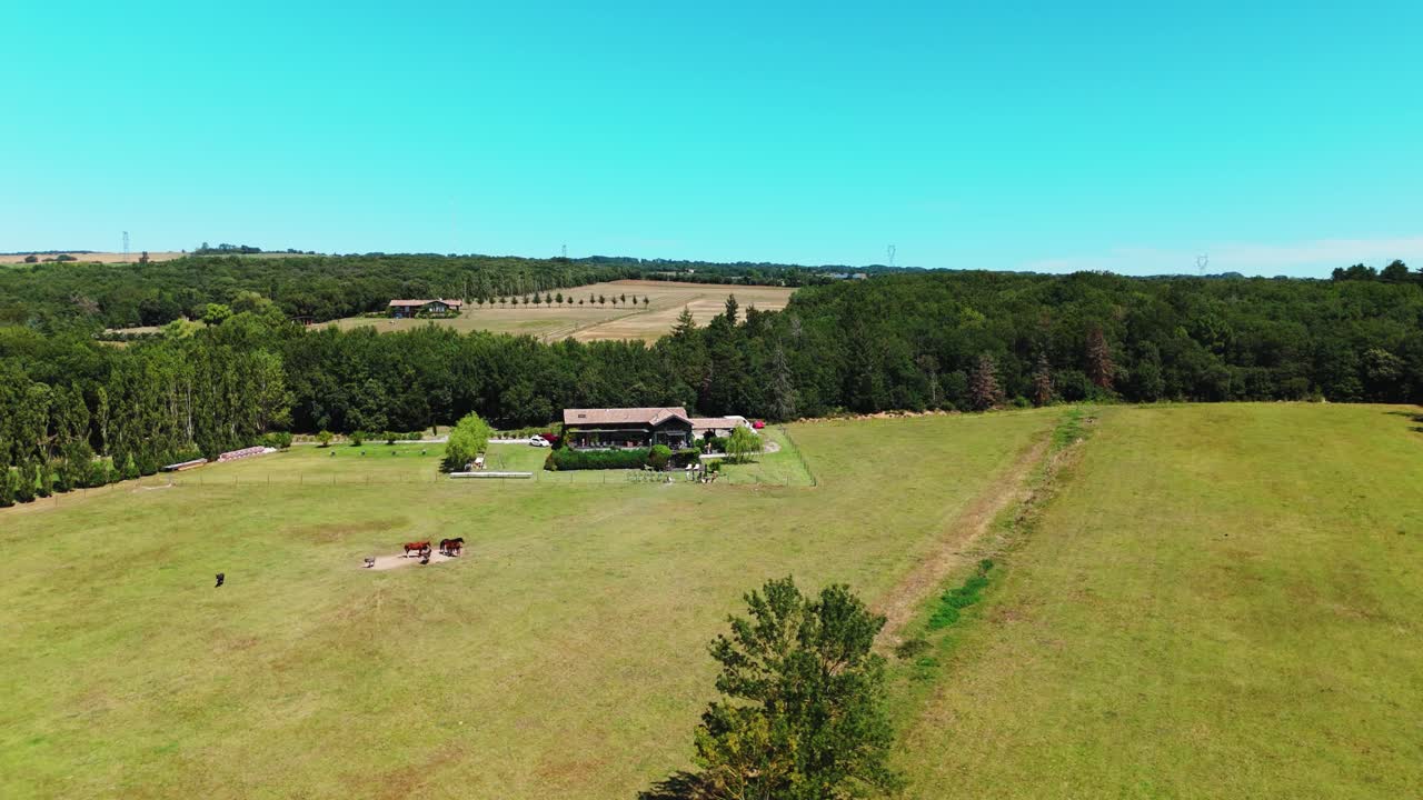 Aerial orbiting shot of a rural agriculture villa in Carcassone, France