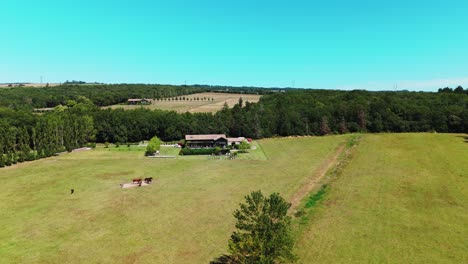 aerial orbiting shot of a rural agriculture villa in carcassone, france