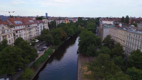 nice aerial top view flight city berlin district neukoeln canal bridge river, germany summer day 2023