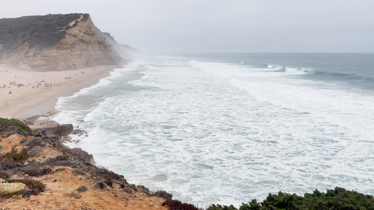 Stunning Coastline of Ericeira with Big Waves on Misty Day in Portugal