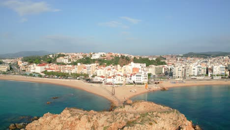 Mediterranean-fishing-city-aerial-images-of-the-main-beach-European-tourism-Blanes-Costa-Brava