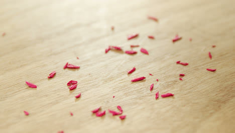 colored pencil shavings on wooden table