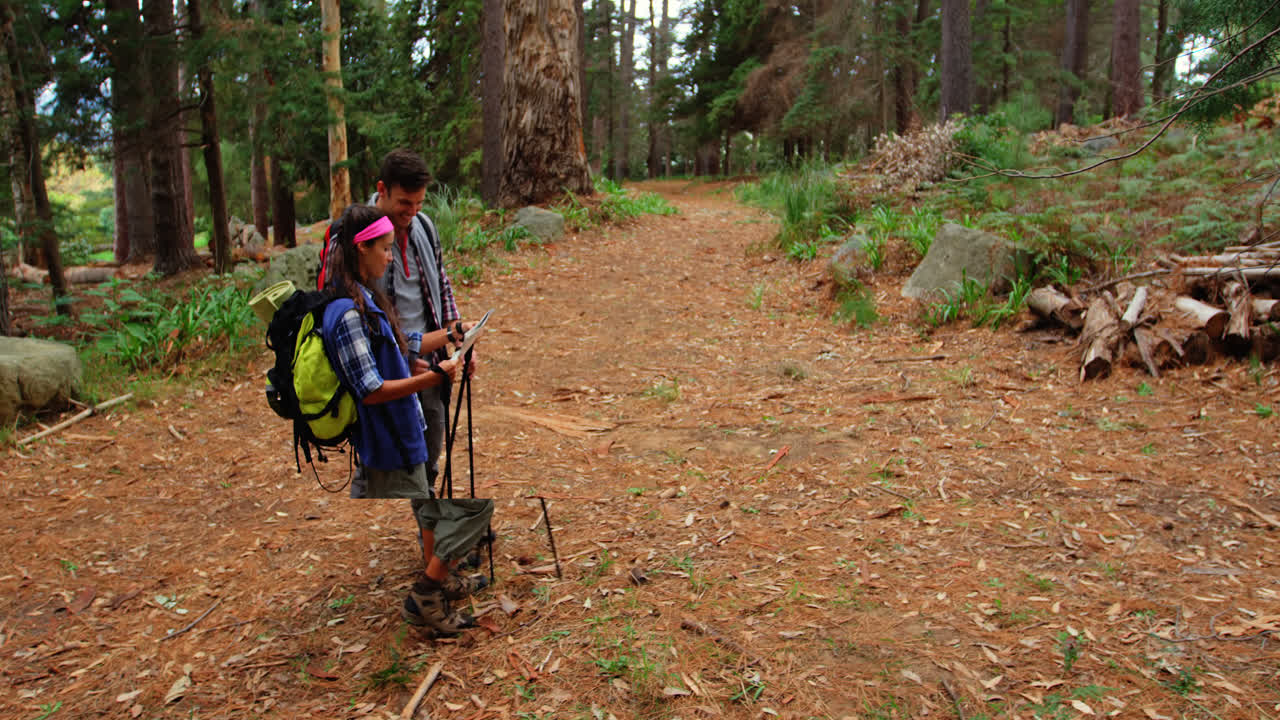 High angle view of hiker couple searching their direction