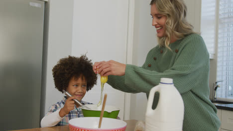 video of biracial son and caucasian mother cooking together