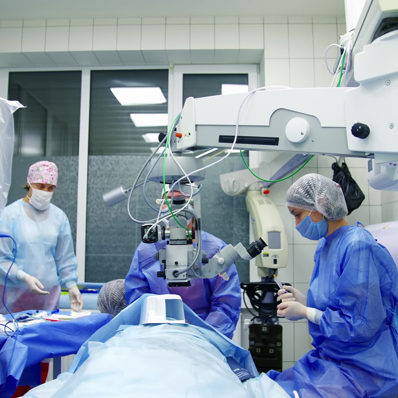 Medical team performing eye surgery