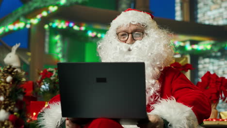 santa claus working on laptop