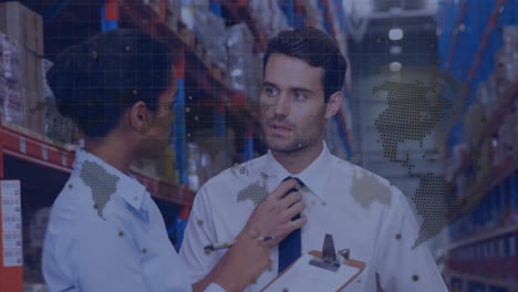 in warehouse, workers discussing logistics with animated world map overlay