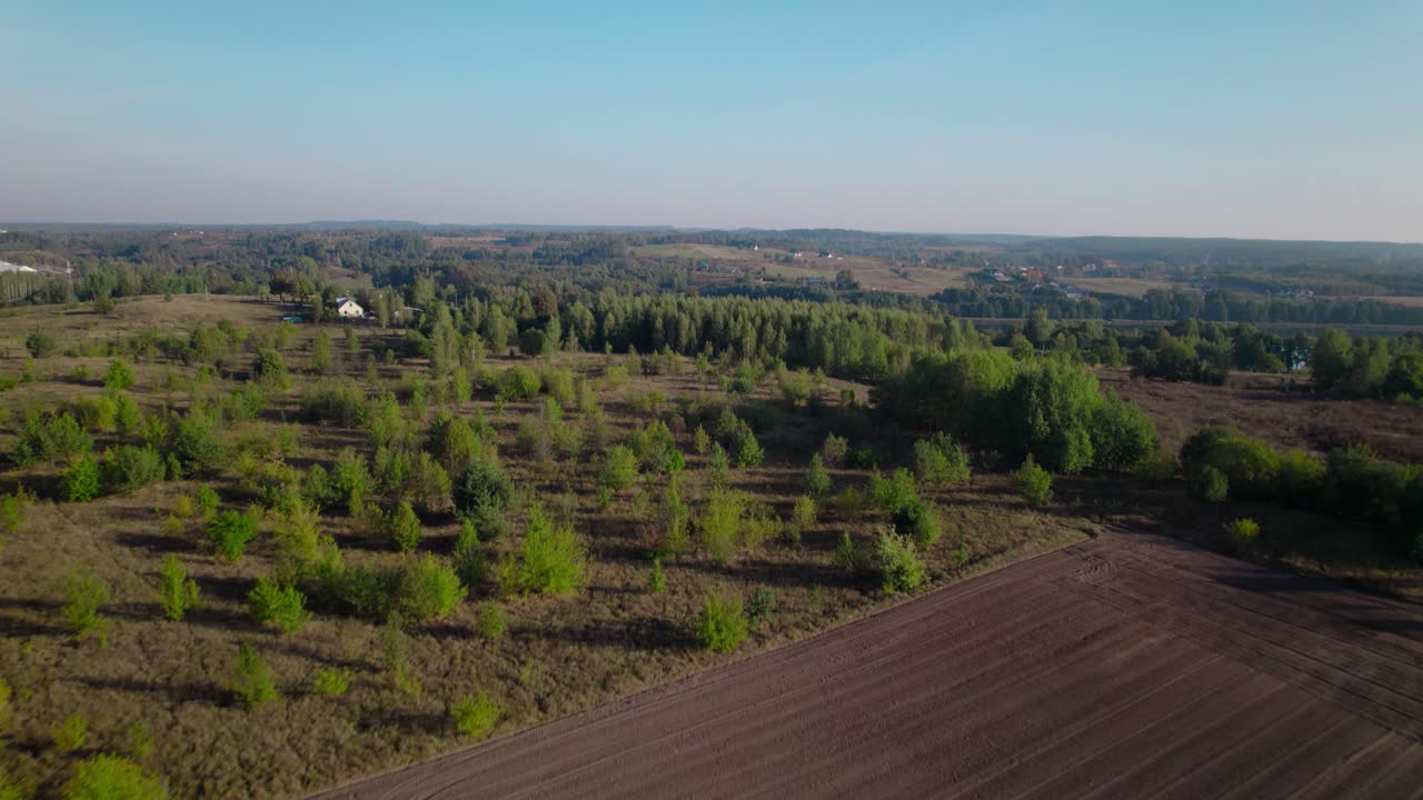 rural landscape of Polish countryside with fields trees and small houses