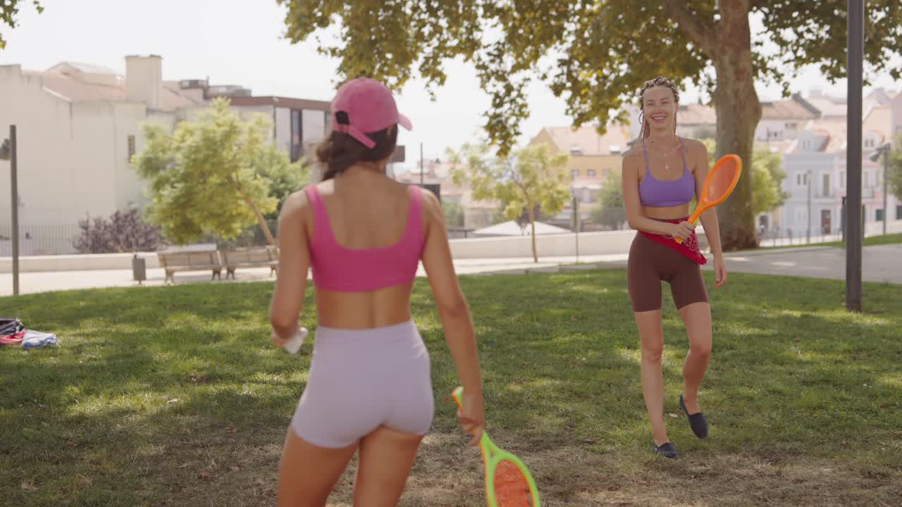 Women playing sports in the park