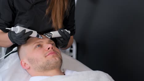 man receiving facial treatment