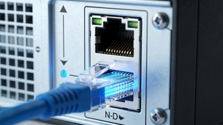 Starting connection, blue Ethernet plug sliding into RJ45 on device rear panel, LEDs brightening