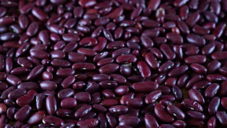 scattered red beans are rotated on the table. high protein legumes,beans and lentils for healthy food.