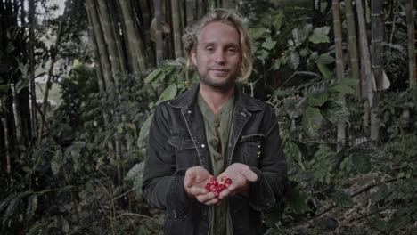 coffee farmer displaying fresh coffee cherries