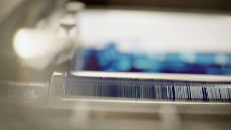 close up of a printing roller covered in ultramarine color, blue