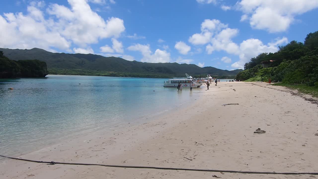 Tourist Boats Moored at Kabira Bay, Ishigaki Island, Okinawa, Japan. Wide Angle Pan Left Shot