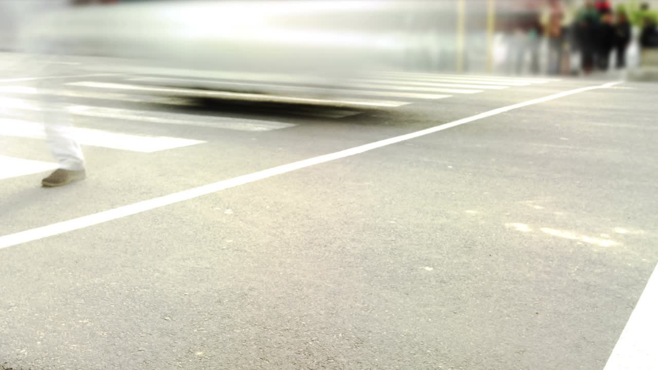 Feet walking across crosswalk as passing bus triggers UI badges spreading, showing engagement