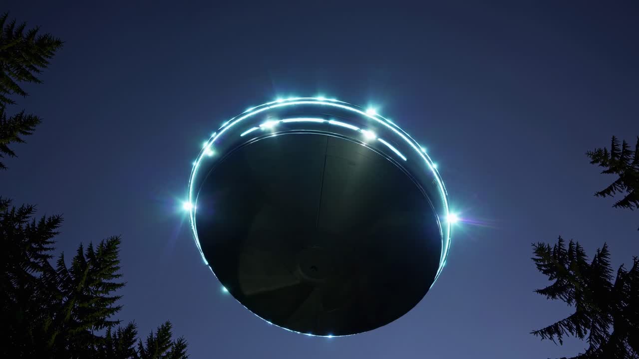 A low-angle video shot of a glowing UFO hovering in a night sky, framed by silhouetted trees