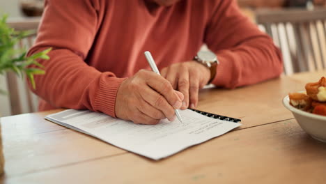 senior man, hands and writing on documents