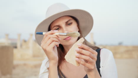 archaeologist examining a fragment