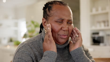 elderly black woman, hands on temple and headache
