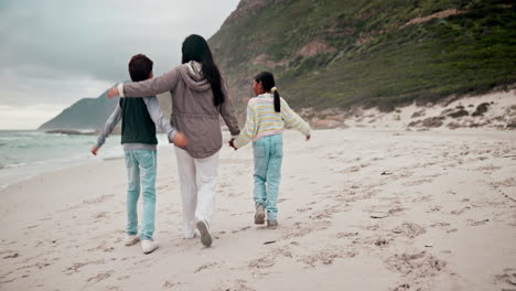 family, beach and walking with hug