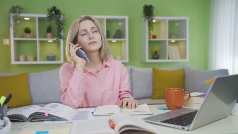 university girl talks on the phone and is unhappy.