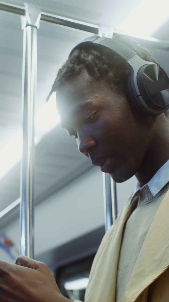 Man with headphones on subway