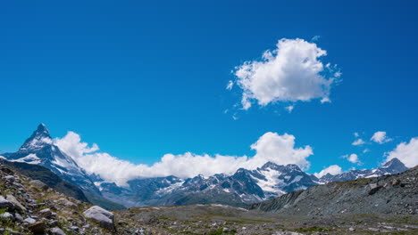 clouds in blue sky over the alpine summits and matterhorn in zermatt, switzerland - time lapse