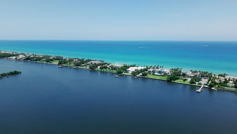 aerial flyover showing clear water near coastline by flagler beach, west palm beach
