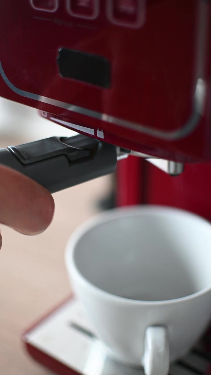 Preparing espresso coffee in a modern kitchen