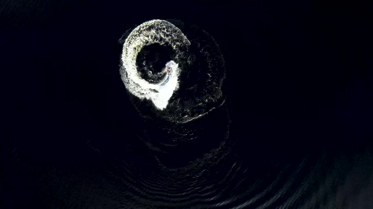 Top down view of someone riding a watercraft.