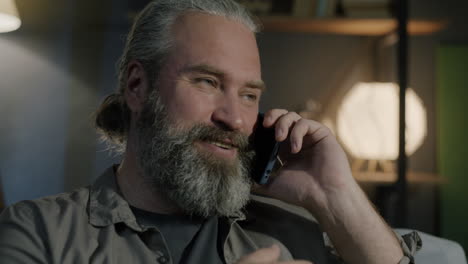 man talking on phone at home